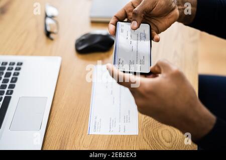 Remote Check Deposit Using Mobile Remote. Taking Photo Stock Photo