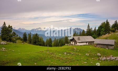 Kohler Alm mountain hut near Inzell, bavarian alps, Chiemgau, with view towards Sonntagshorn and Loferer Steinberge Stock Photo