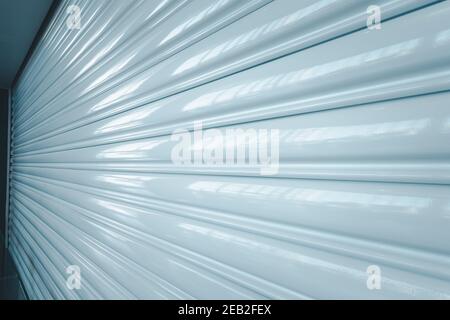 Shutter Roller Door Metal Texture of Shopping Mall or Factory Warehouse Workshop, Entrance Rolling Steel Doors for Access Security. Modern Architectur Stock Photo