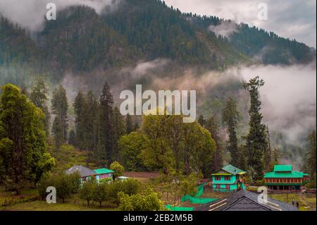 Scenic view in the Himalayan range. Sunrise view from the dense forest of Himalayan village Grahan, Kasol, Himachal Pradesh, India. Stock Photo