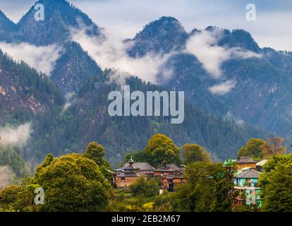 Scenic view in the Himalayan range. Sunrise view from the dense forest of Himalayan village Grahan, Kasol, Himachal Pradesh, India. Stock Photo