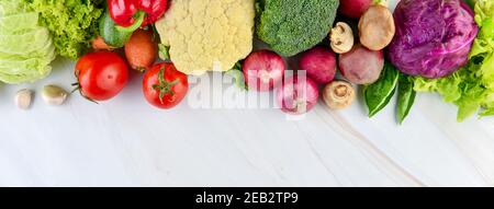 Colorful fresh healthy vegetables on marble kitchen countertop banner background with copy space Stock Photo