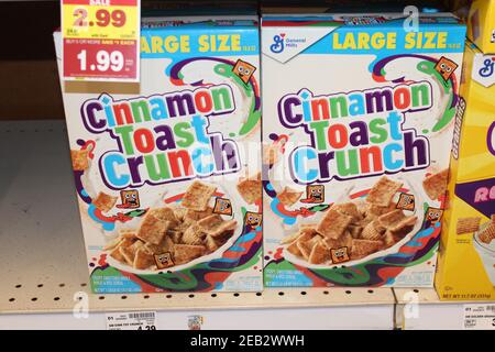 Cinnamon Toast Crunch shot closeup that's bright and colorful on a metal shelf at a grocery store in Kansas. Stock Photo