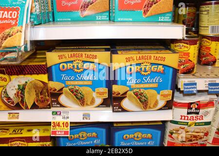 Ortega Taco shells shot closeup in a grocery store on a metal shelf that's bright and colorful in Kansas. Stock Photo