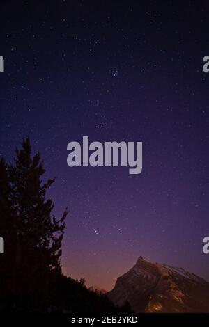 The night sky over the town of Banff in Banff National Park, Alberta, Canada Stock Photo