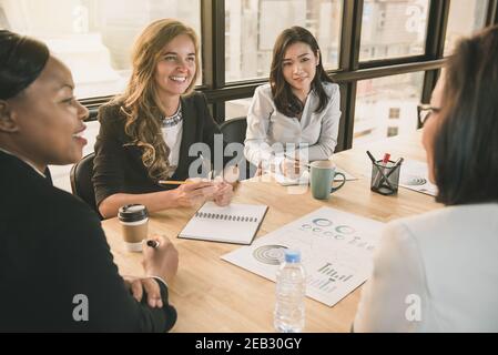 Japanese businesswoman having a meeting with international team, diverse female leader concept Stock Photo