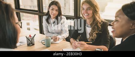 Japanese businesswoman having a meeting with international team, diverse female leader concept, banner size Stock Photo