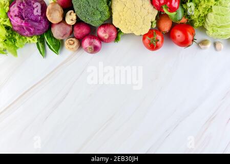 Fresh colorful healthy vegetables on marble kitchen countertop background with copy space Stock Photo