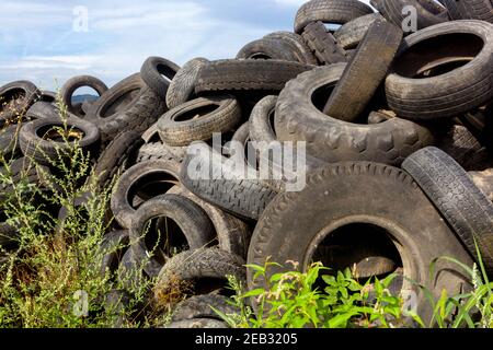 Old tires garbage depot rubbish car tires used waste heap trash dumped Stock Photo