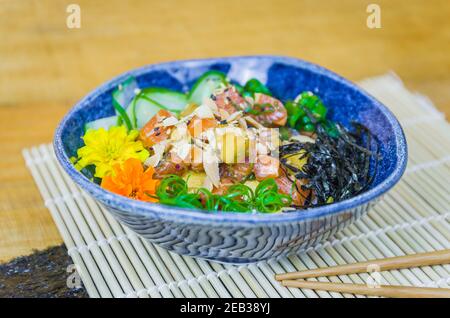 Traditional poke in beautiful decorated dish Stock Photo