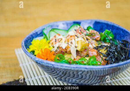 Traditional poke in beautiful decorated dish Stock Photo