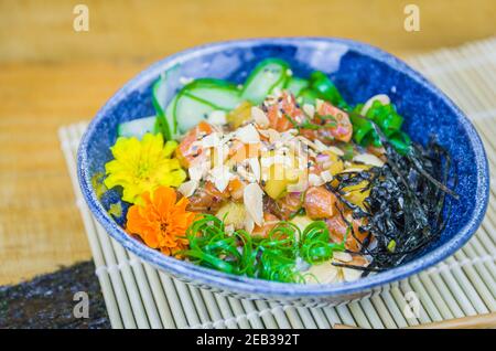 Traditional poke in beautiful decorated dish Stock Photo