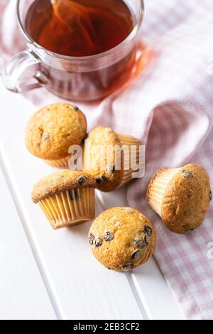 Vanilla muffins. Sweet cupcakes on white table. Stock Photo
