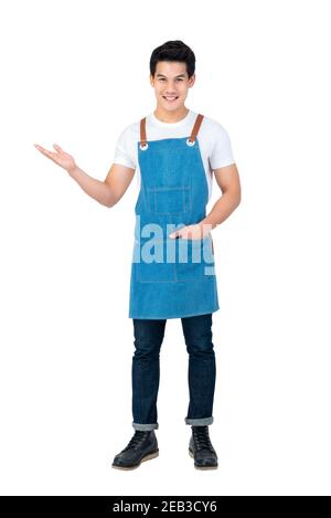 Handsome Asian man wearing apron with open hand standing in white background Stock Photo