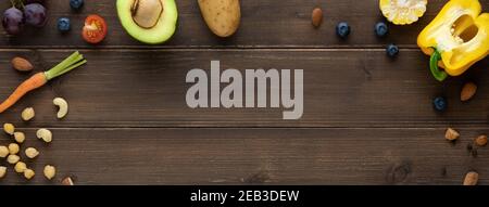 Nutrient-rich organic healthy foods on wood banner background  with copy space Stock Photo