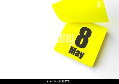 May 8th. Day 8 of month, Calendar date. Close-Up Blank Yellow paper reminder sticky note on White Background. Spring month, day of the year concept Stock Photo