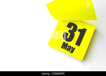 May 31st . Day 31 of month, Calendar date. Close-Up Blank Yellow paper reminder sticky note on White Background. Spring month, day of the year concept Stock Photo