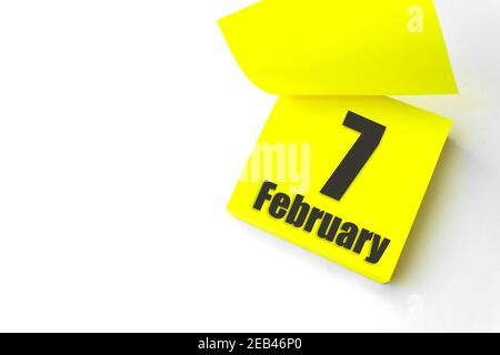 February 7th. Day 7 of month, Calendar date. Close-Up Blank Yellow paper reminder sticky note on White Background. Winter month, day of the year conce Stock Photo