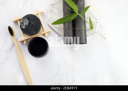 Activated Bamboo charcoal tooth powder on marble background. Stock Photo
