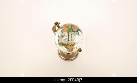 Glass globe on a white background. Transparent sphere, continents and oceans. Russia, Europe, Africa. Stock Photo