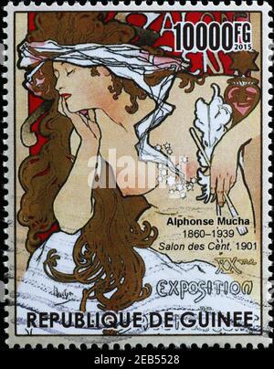 Image of a woman painted by Alphonse Mucha on stamp Stock Photo