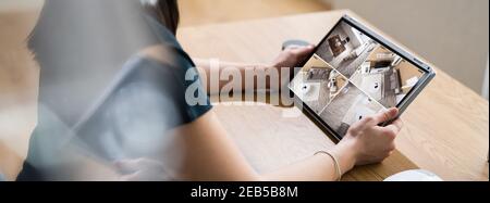 Monitoring CCTV Security Camera Using Spy Gadgets Stock Photo