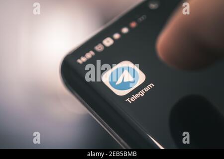 Barnaul. Russia. February 9, 2021: Telegram application icon on smartphone screen close-up. Telegram app icon with copy space Stock Photo