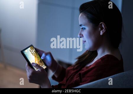 Watching Online Video Or Photo Online On Tablet Stock Photo