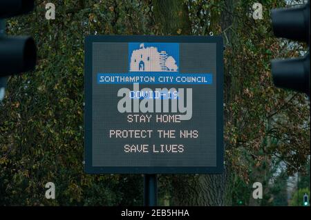 Southampton, UK, 11 Feb, 2021. A city digital information sign on Winchester Road in the city of Southampton, Hampshire, displays one of the UK's covid-19 slogans that reads 'Stay Home, Protect the NHS, Save Lives'.  This photograph was taken during the third UK coronovirus lockdown. Stock Photo