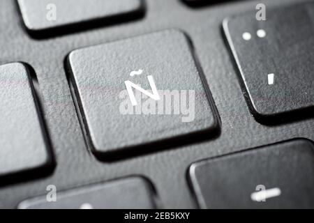 Spanish letter on a gray laptop keyboard. Stock Photo