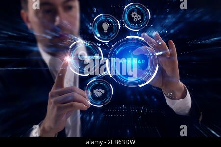 Business, Technology, Internet and network concept. Young businessman working on a virtual screen of the future and sees the inscription: Webinar Stock Photo