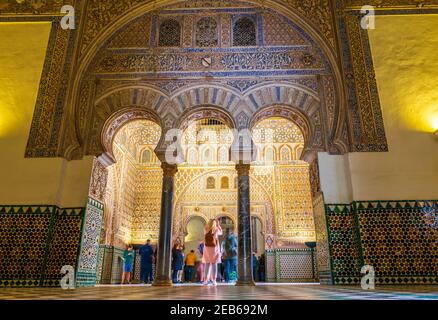 Room with Moorish ornaments at the Palace of the Real Alcazar in Seville in Andalusia, Spain Stock Photo