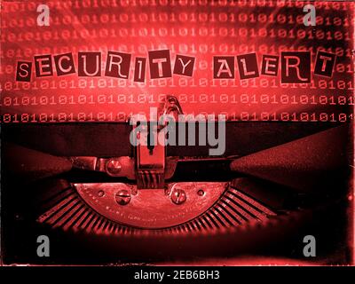 Security Alert, Typewriter, Binary code background, Red tone Stock Photo