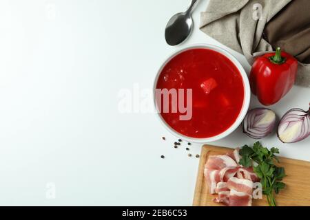 Concept of tasty eating with borscht and ingredients on white background Stock Photo