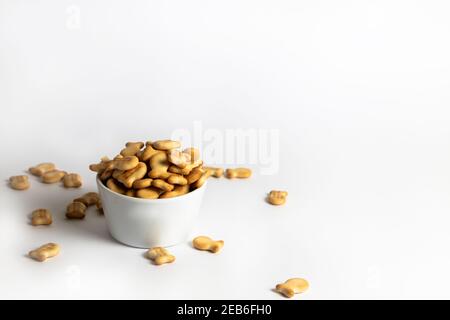 Fish-shaped crackers in a white bowl Stock Photo