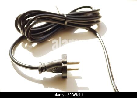 Black power plug on white background with shadow Stock Photo