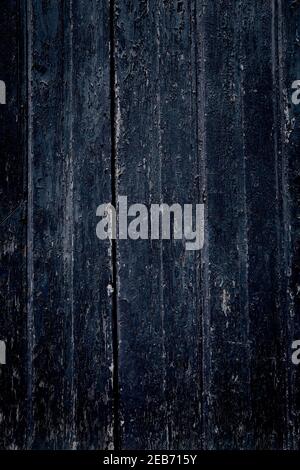 Dark distressed wood texture. Grunge dark blue distressed wooden door boards. Old wood backdrop. Stock Photo