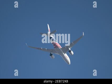 London, UK. 12 February 2021. Air traffic over London during the Covid-19 pandemic. A Malaysia Airlines Airbus A350 with Malaysia Negaraku Livery flies over Wimbledon after leaving London Heathrow en route to Kuala Lumpur. Credit: Malcolm Park/Alamy. Stock Photo
