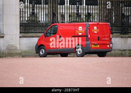 LONDON, UK - APRIL 23, 2016: Royal Mail delivery van Vauxhall Vivaro in front of Buckingham Palace, London, UK. Royal Mail was founded in 1516. It emp Stock Photo