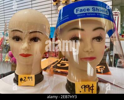 Closeup shot of two head mannequins wearing full-face shields on display Stock Photo