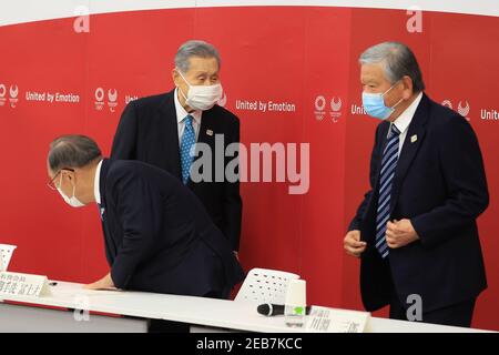 Tokyo, Japan. 12th Feb 2021. (210212) -- TOKYO, Feb. 12, 2021 (Xinhua) -- Mori Yoshiro (C), president of Tokyo Organising Committee of the Olympic and Paralympic Games (Tokyo 2020), exchanges bows with former Japan Football Association president Kawabuchi Saburo (R) and honorary president Mitarai Fujio (L) upon his arrival at a meeting with council and executive board members at the committee headquarters in Tokyo, Japan, on Feb. 12, 2021. Credit: Xinhua/Alamy Live News Stock Photo