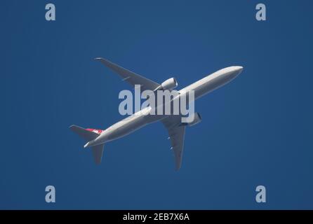 London, UK. 12 February 2021. Air traffic over London during the Covid-19 pandemic. A Turkish Airlines Boeing 777 flies over Wimbledon after leaving London Heathrow en route to Istanbul. Credit: Malcolm Park/Alamy. Stock Photo