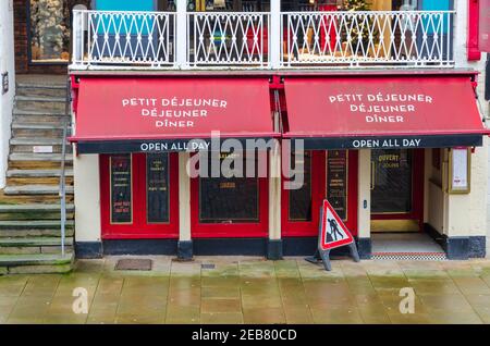 Chester; UK: Jan 29, 2021: The permanently closed branch of Cafe Rouge on Bridge Street are seen here with a road works sign beside the door. Stock Photo