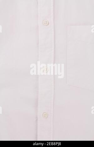 a button on a white men's shirt close up Stock Photo