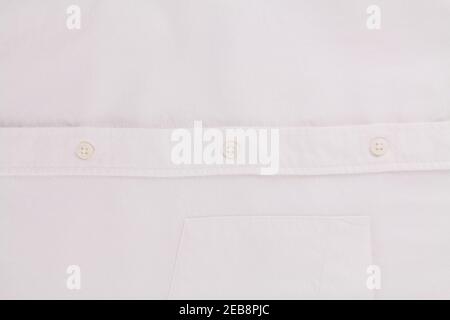 a button on a white men's shirt close up Stock Photo