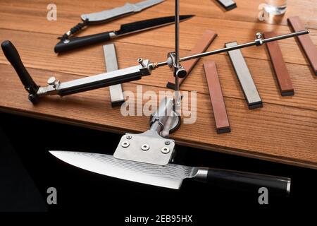 Gorgeous Japanese knife mounted in a manual sharpener machine Stock Photo