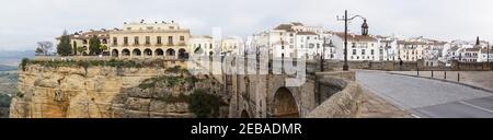 Ronda, Spain - 2 February, 2021: A panorama view of the old town of Ronda and the Puente Nuevo over El Tajo Gorge