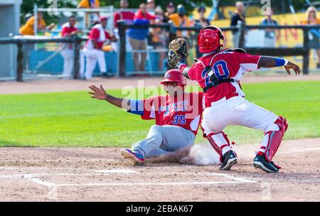 Puerto Rico beats the Dominican Republic in Toronto PanAm Games 2015: Jesus Feliciano designated hitter scores by sliding in home base Stock Photo