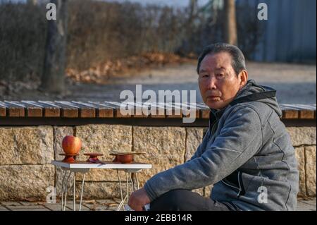 Paju, South Korea. 12th Feb, 2021. Hyeon Seong-taek, who was born in North Korea but came to the South alone in 1951 sits near the DMZ at Imjingak Park in Paju, South Korea on February 12, 2021. He made an offering on Lunar New Year for his family members back in North Korea. Photo by Thomas Maresca/UPI Credit: UPI/Alamy Live News Stock Photo