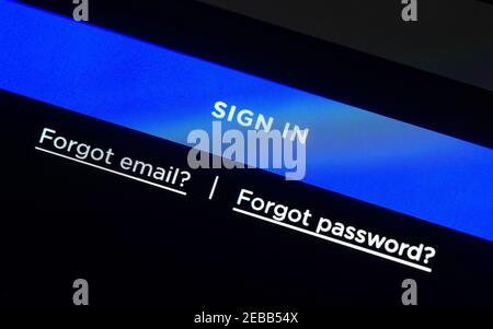 Blue sign in button on LCD screen, login web page, two links for forgotten email and password Stock Photo